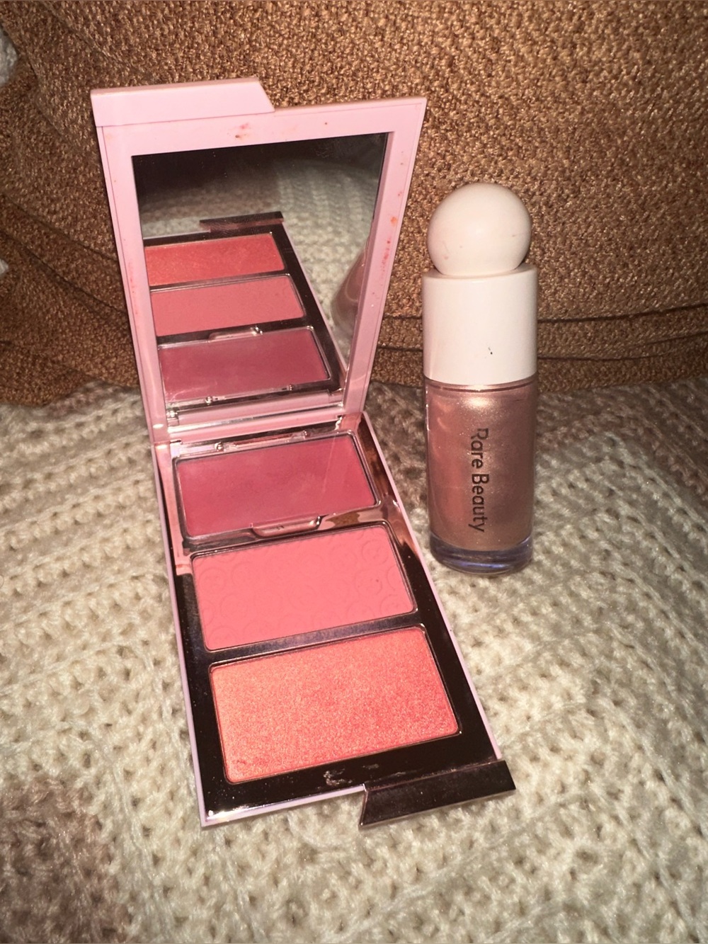 Rare Beauty liquid highlighter and O/S blush Palette.